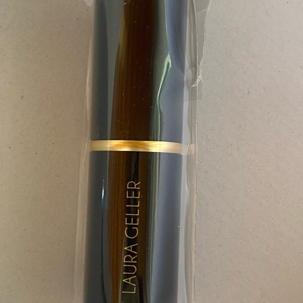 Laura Geller Black and Gold Lipstick Tube